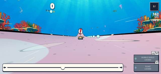 An underwater slide passes bright coral and sea creatures.